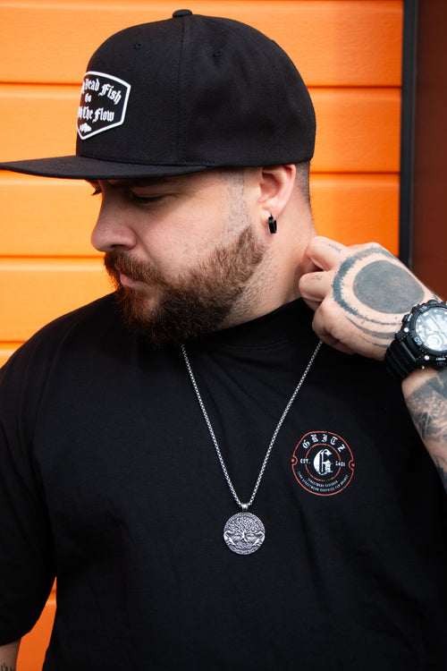 Every Dog Has Its Day Graphic T-Shirt – model wearing black oversized Gritz Streetwear tee, front editorial shot