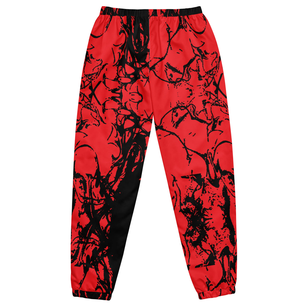 Red and black abstract splatter print jogger pants with a black side panel and black drawstring waist.