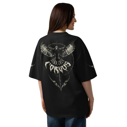 A woman shown from the back wearing an oversized black t-shirt with a large distressed gold graphic of a raven and the word 'CORVUS' on the back, paired with blue jeans against a plain white background.